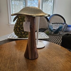 Mushroom wood and gold sculpture.